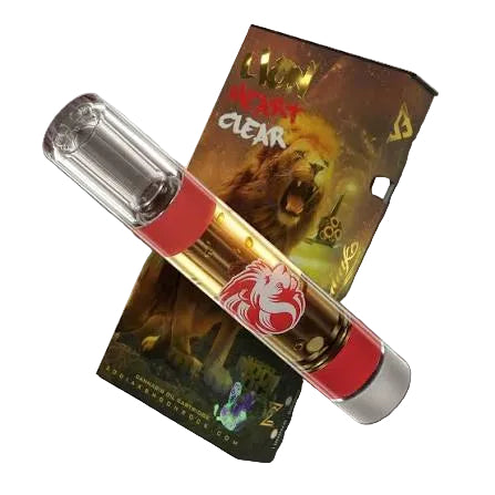 A clear glass vape pen with red bands and a red lion logo, shown diagonally over its illustrated retail box featuring a lion and the text &