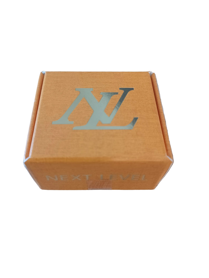A small orange cardboard box with a metallic silver &